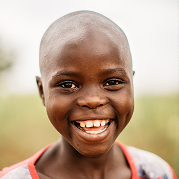 A young girl from Burundi smiling