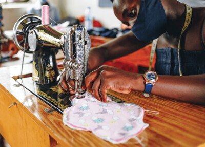 fabric sanitary pads in pink with moons, stars, clouds and suns as pattern