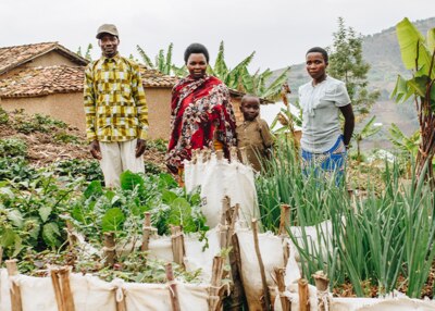 family in front of their farm