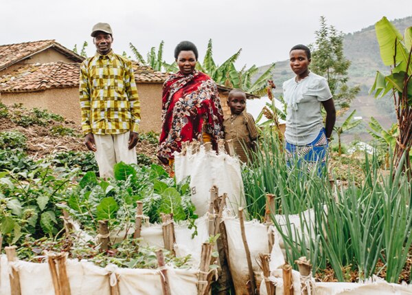 family in front of their farm
