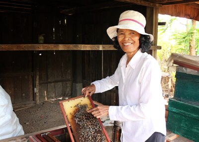 a beekeeper showing her bees