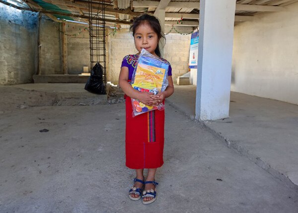 girl holding books