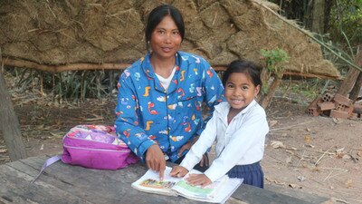 mother and daughter reading a book